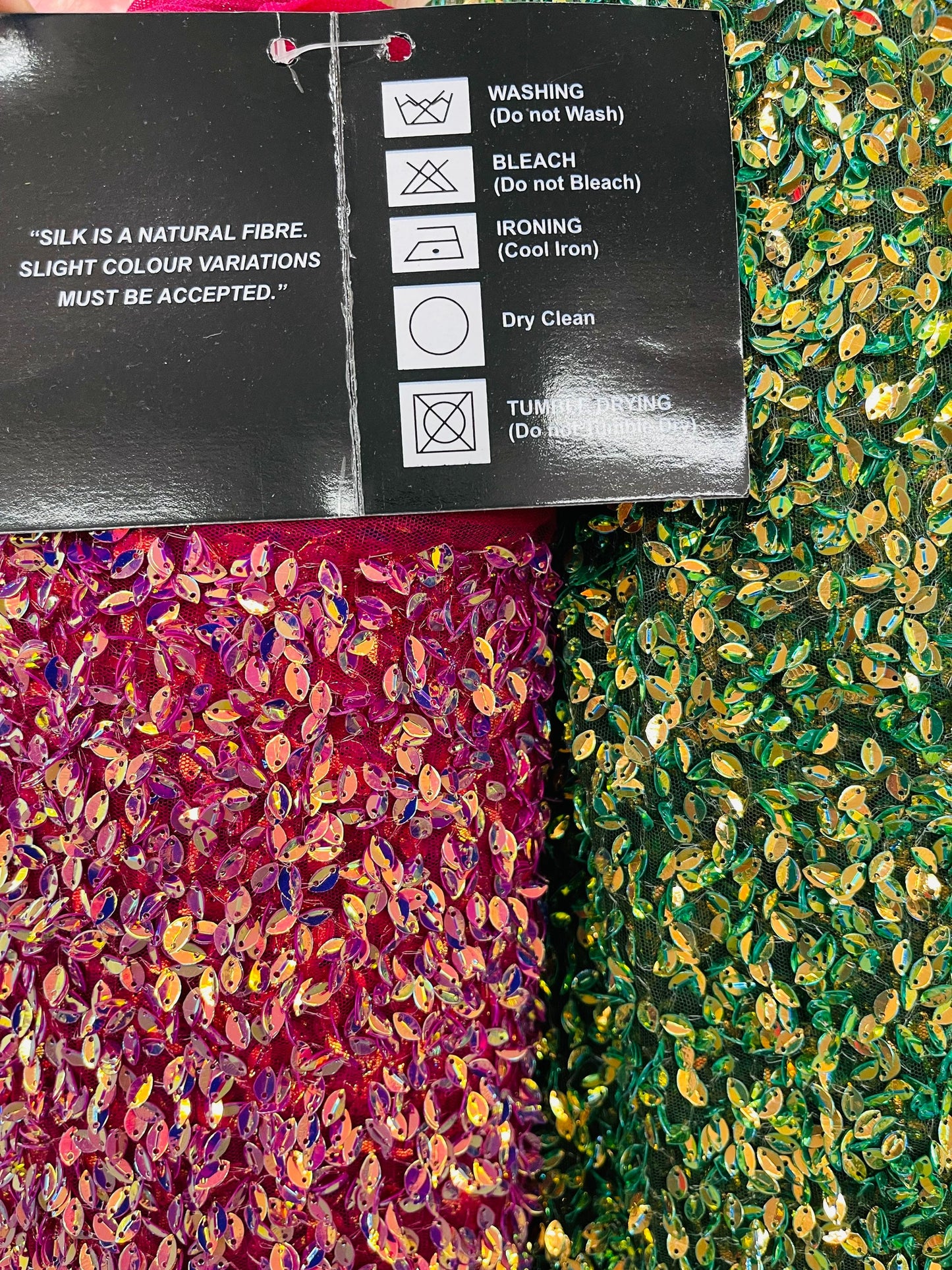 Luxury France Iridescent sequins embroidered on silk mesh base 2-way stretch 54/55” Sold by the YD. Ships Worldwide from Los Angeles CA USA.