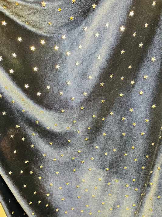 New stretch velvet with stars design black/Gold  4-way strech  58/60" Sold by the YD. Ships worldwide from Los Angeles California USA.