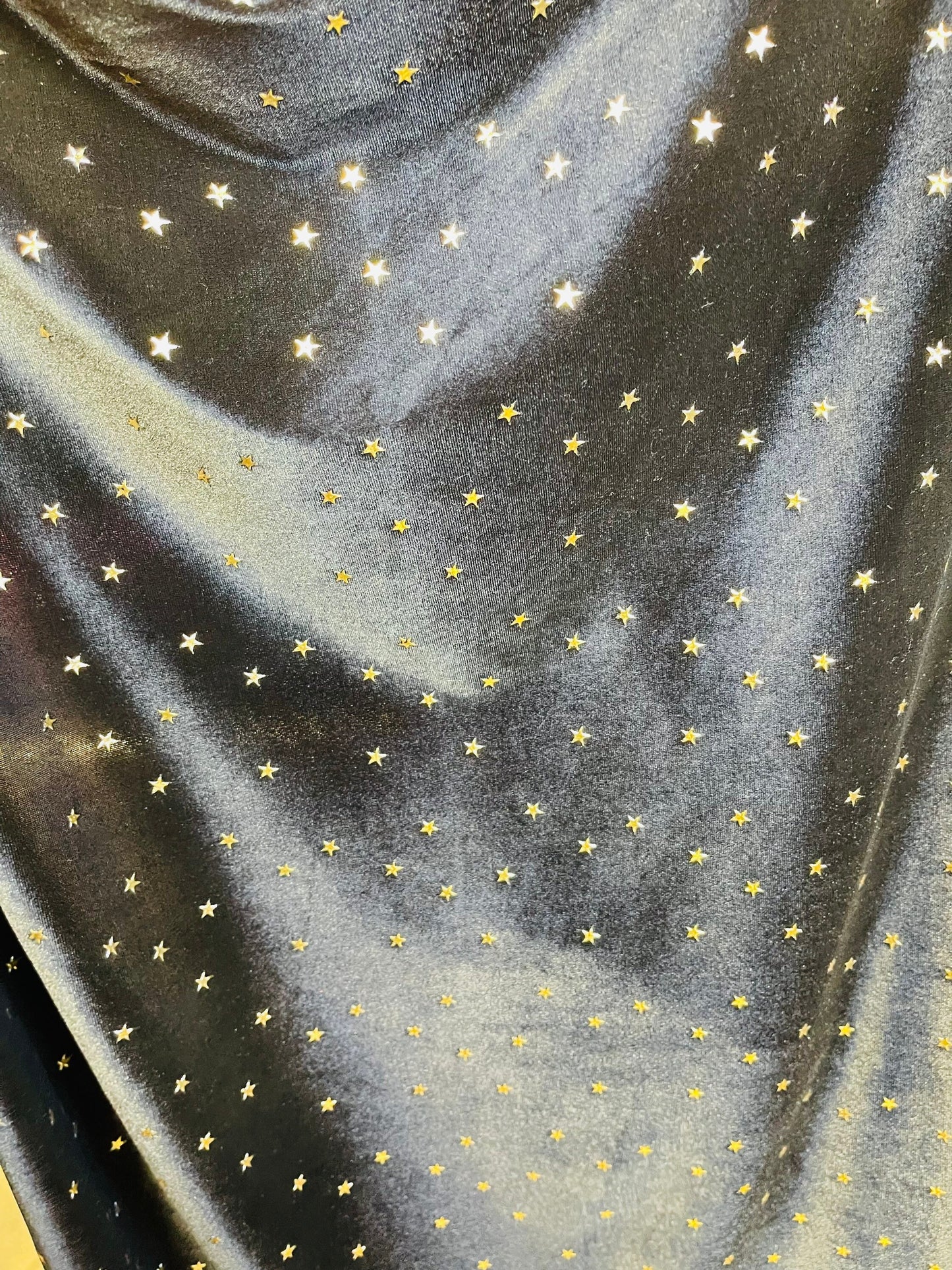 New stretch velvet with stars design black/Gold  4-way strech  58/60" Sold by the YD. Ships worldwide from Los Angeles California USA.