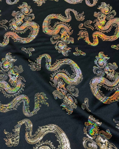 New Dragon design print on metallic nylon spandex Black Iridescent gold 4-way stretch spandex 58/60” Sold by the YD. Ships worldwide
