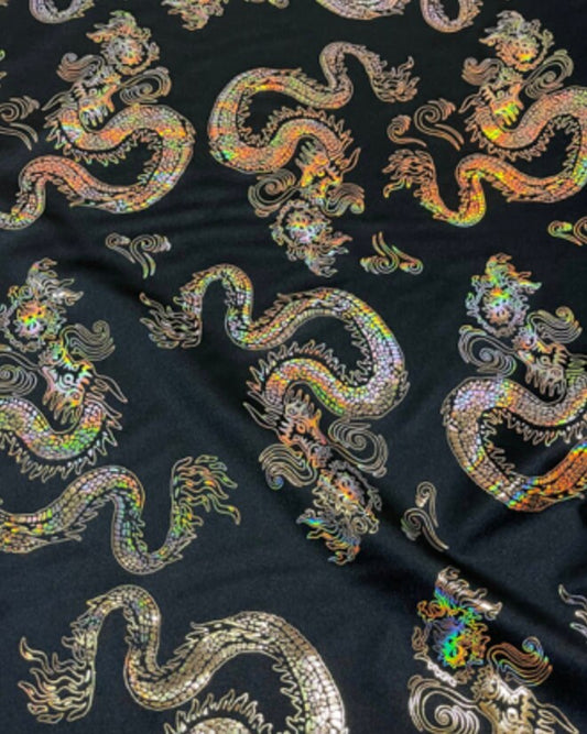 New Dragon design print on metallic nylon spandex Black Iridescent gold 4-way stretch spandex 58/60” Sold by the YD. Ships worldwide
