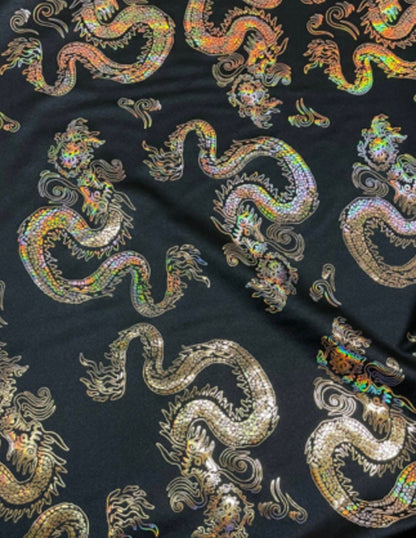 New Dragon design print on metallic nylon spandex Black Iridescent gold 4-way stretch spandex 58/60” Sold by the YD. Ships worldwide