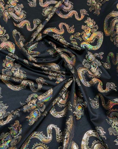 New Dragon design print on metallic nylon spandex Black Iridescent gold 4-way stretch spandex 58/60” Sold by the YD. Ships worldwide