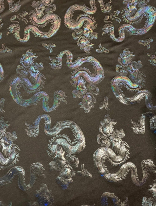 New Dragon design print on metallic nylon spandex Black Iridescent black 4-way stretch spandex 58/60” Sold by the YD. Ships worldwide