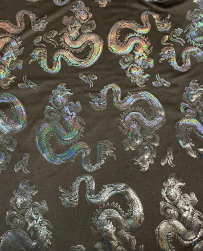 New Dragon design print on metallic nylon spandex Black Iridescent black 4-way stretch spandex 58/60” Sold by the YD. Ships worldwide