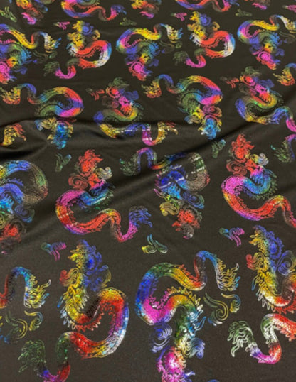 New Dragon design print on metallic nylon spandex Black Iridescent rainbow 4-way stretch spandex 58/60” Sold by the YD. Ships worldwide