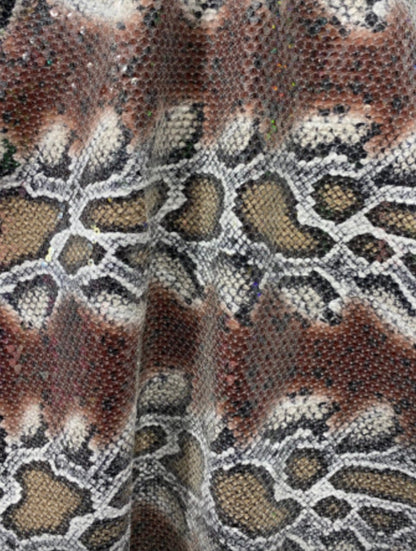 Python snake design print on poly spandex with clear sequins all over 2-way stretch 55/57” Sold by the YD. Ships Worldwide from L.A