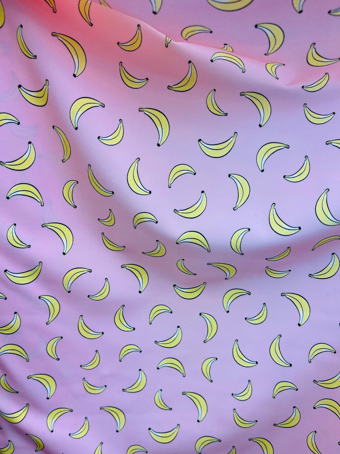 New Banana design blush/yellow print on great quality of Nylon Spandex 4-way stretch 58/60” Sold by the YD. Ships Worldwide from Los Angeles
