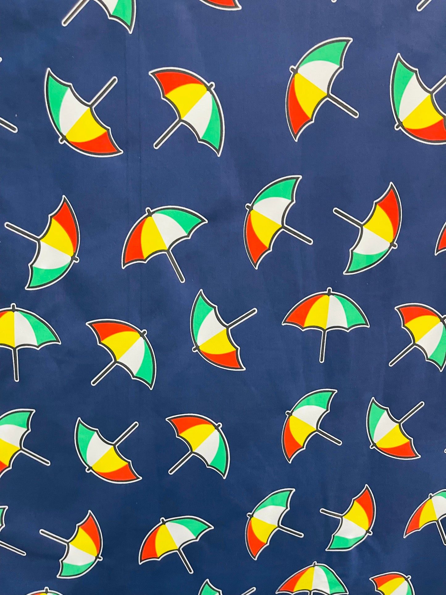 New umbrella design print on poly spandex 4-way stretch navy/multicolor 58/60” Sold by the YD. Ships Worldwide from Los Angeles California