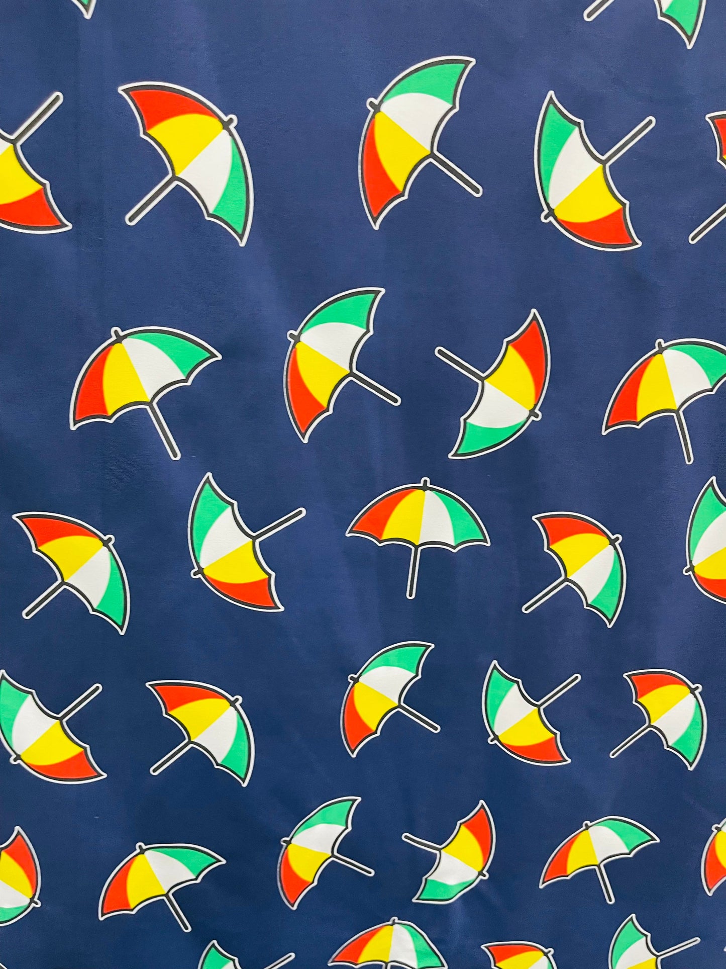 New umbrella design print on poly spandex 4-way stretch navy/multicolor 58/60” Sold by the YD. Ships Worldwide from Los Angeles California