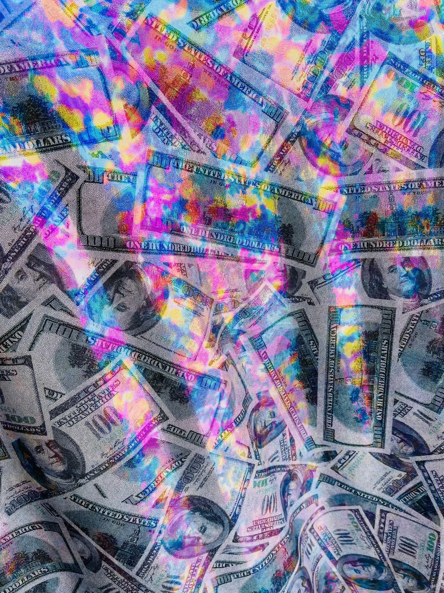 New modern money design iridescent green with rainbow foil nylon spandex 4-way stretch 58/60” Sold by the YD. Ships Worldwide from L.A CA.