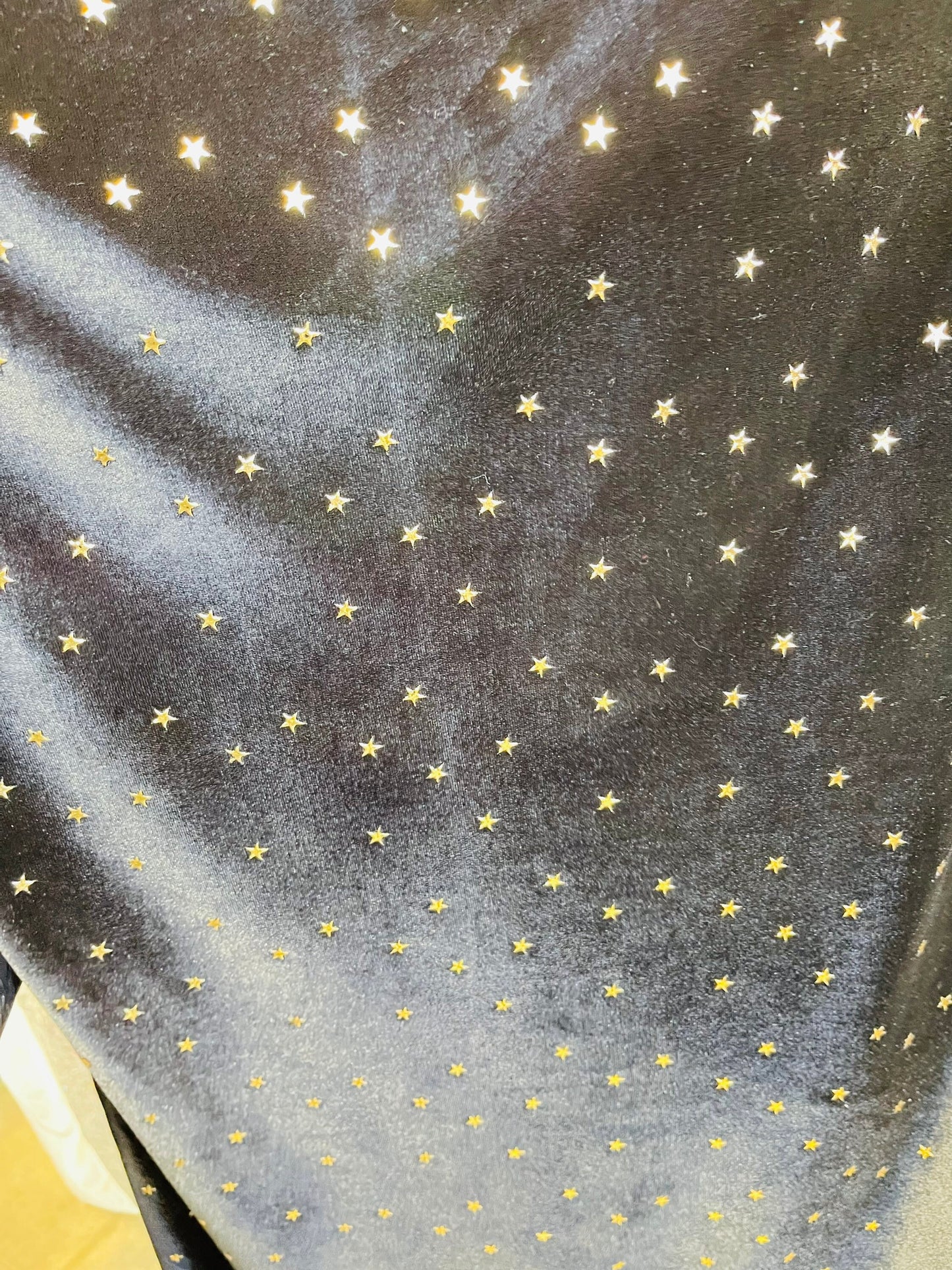 New stretch velvet with stars design black/Gold  4-way strech  58/60" Sold by the YD. Ships worldwide from Los Angeles California USA.