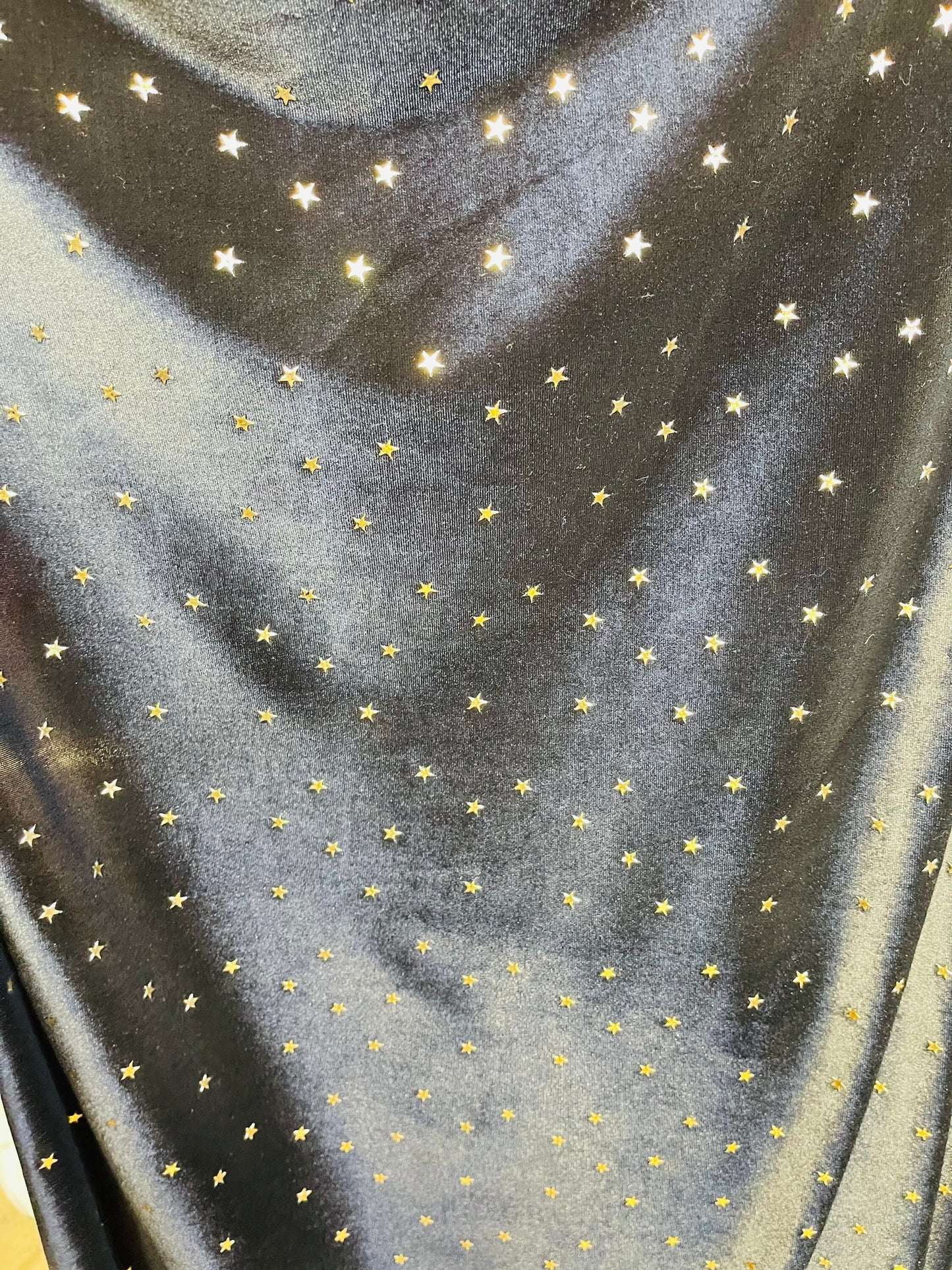 New stretch velvet with stars design black/Gold  4-way strech  58/60" Sold by the YD. Ships worldwide from Los Angeles California USA.