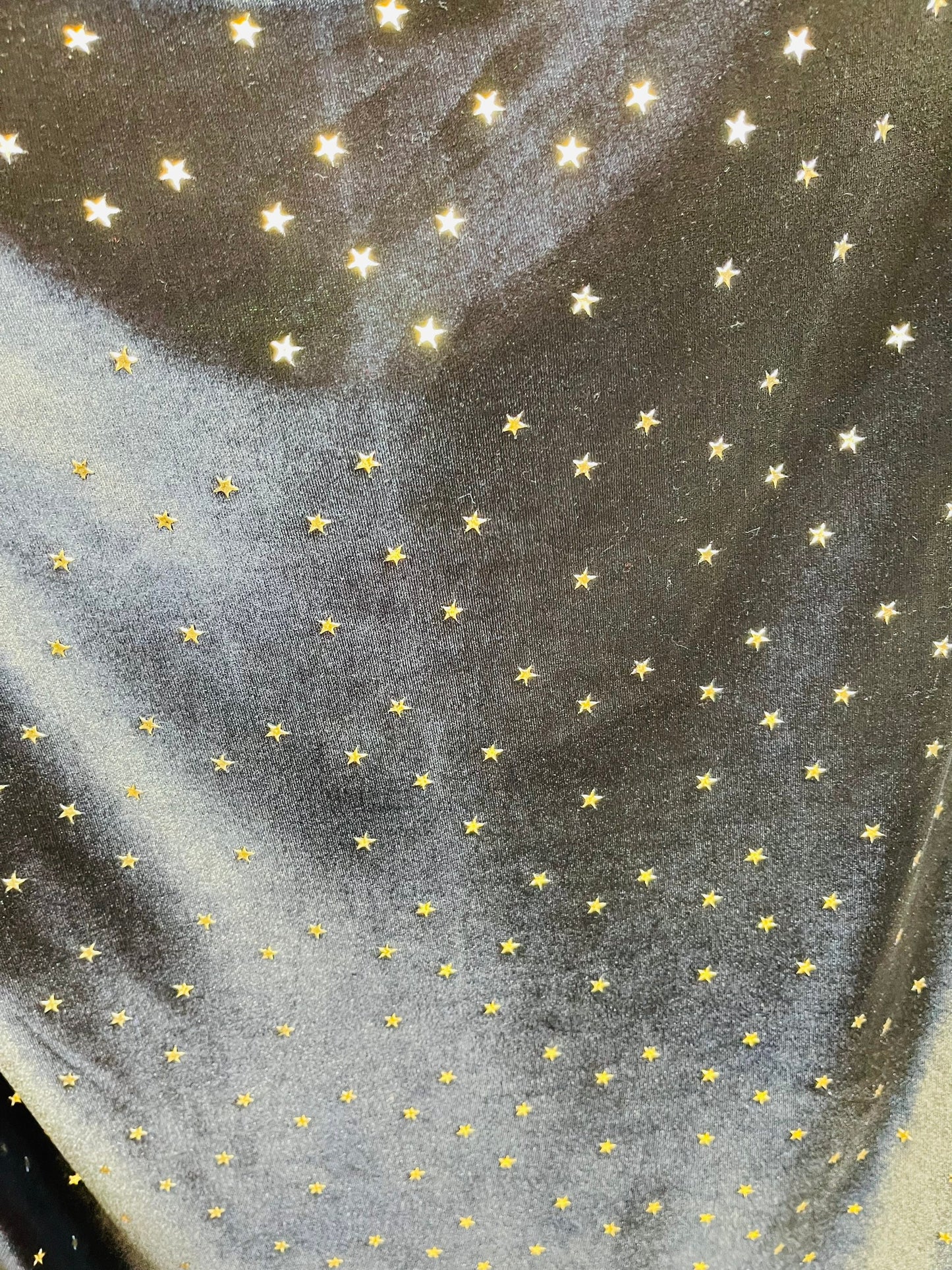 New stretch velvet with stars design black/Gold  4-way strech  58/60" Sold by the YD. Ships worldwide from Los Angeles California USA.