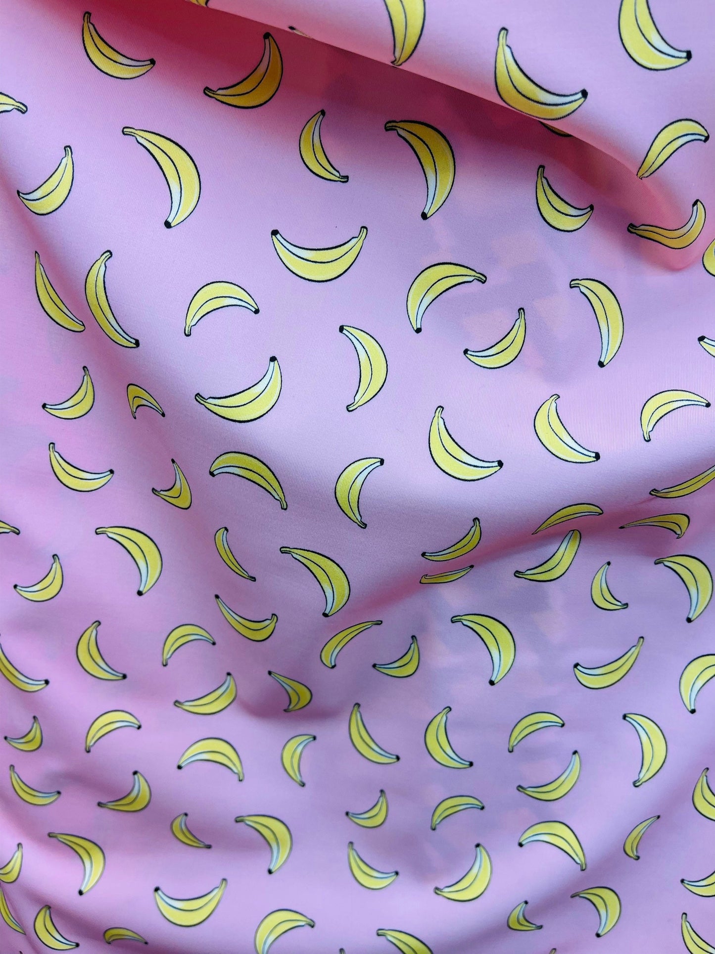 New Banana design blush/yellow print on great quality of Nylon Spandex 4-way stretch 58/60” Sold by the YD. Ships Worldwide from Los Angeles