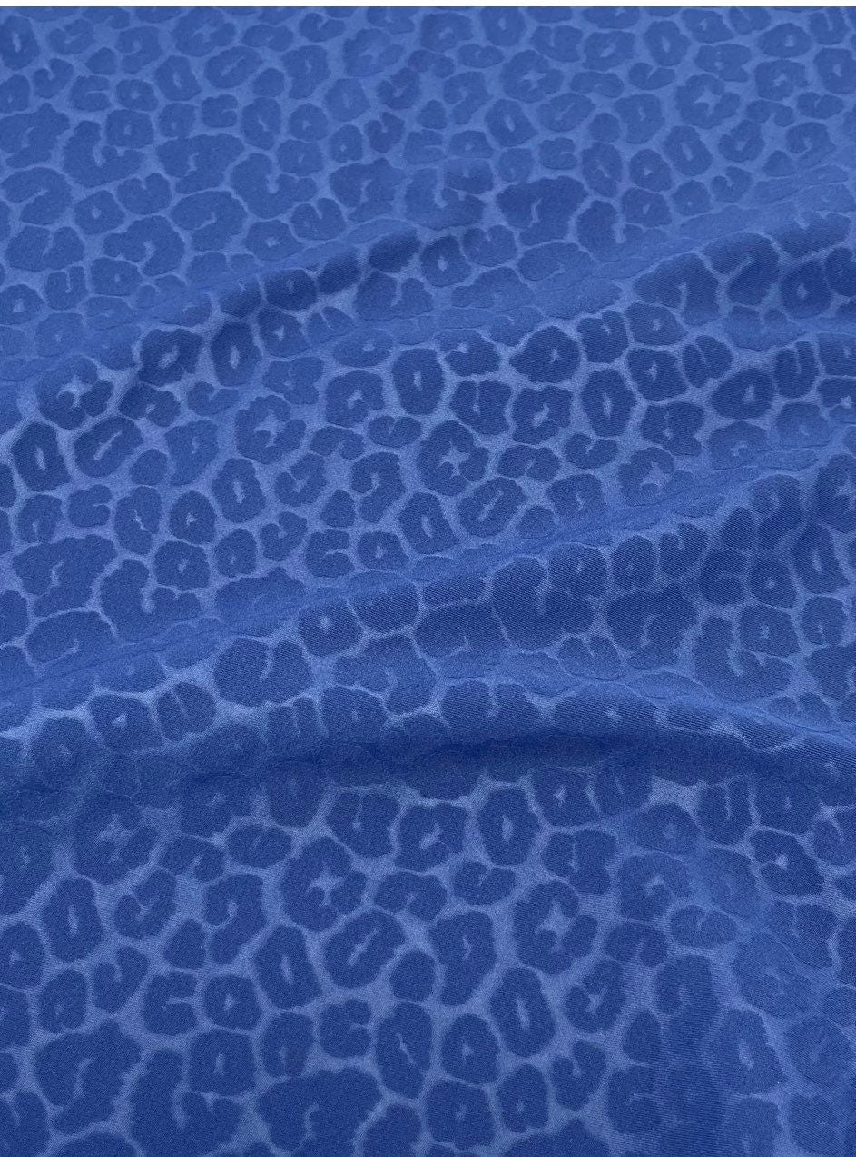 New Exotic Leopard design embossed nylon spandex 4-way stretch 58/60” Sold by the YD. Ships Worldwide from Los Angeles California USA.