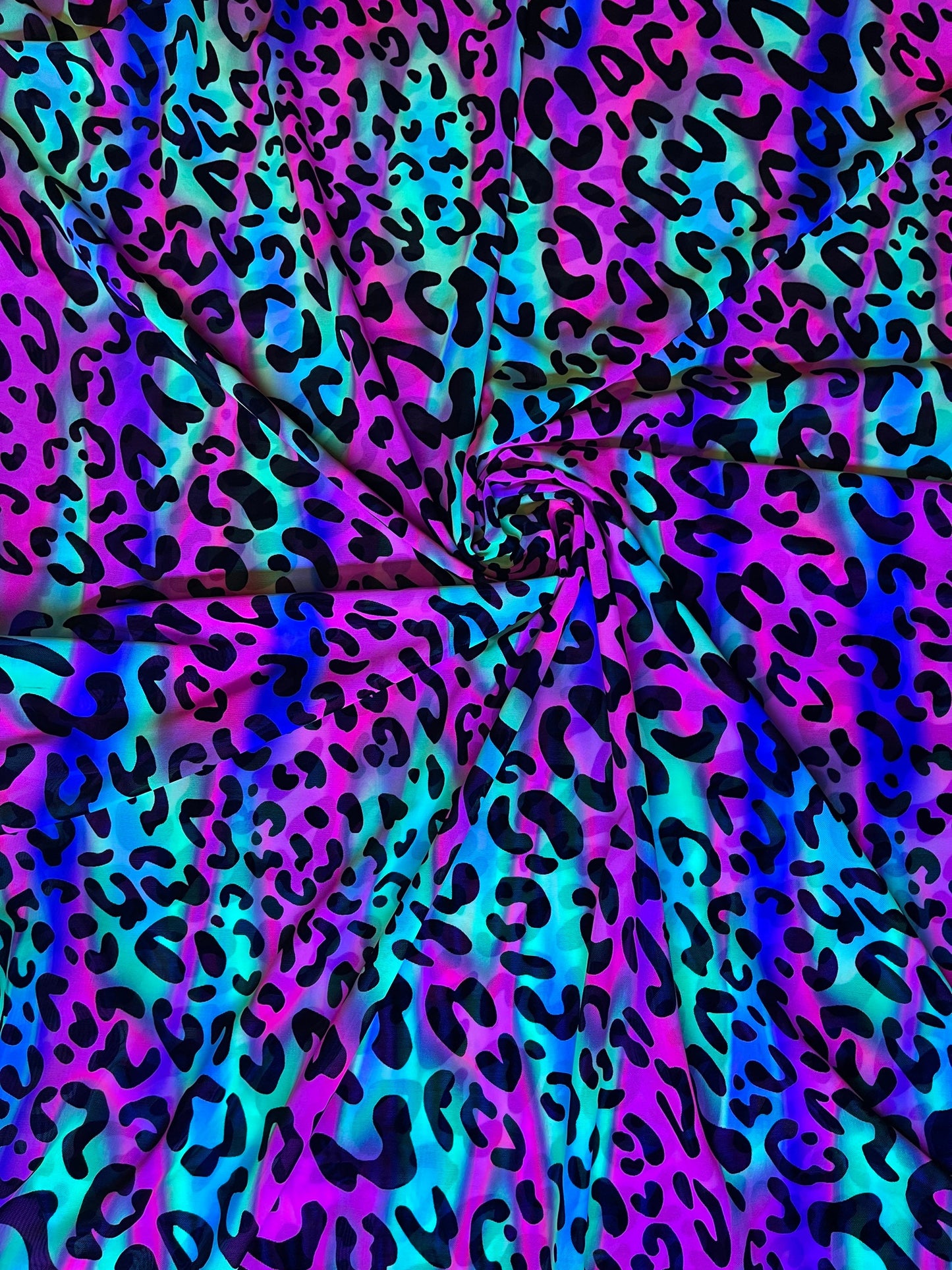 Exotic Leopard design it glows in the dark with black light print on best quality of nylon power mesh 4-way stretch 58/60” Sold by the YD.