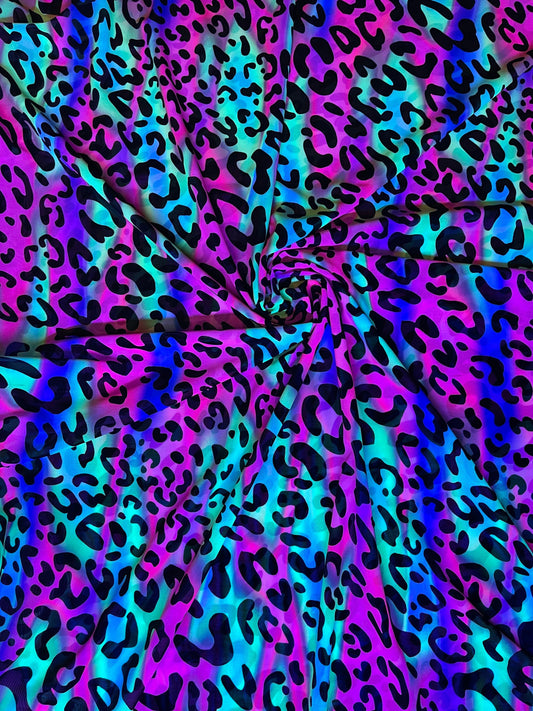 Exotic Leopard design it glows in the dark with black light print on best quality of nylon power mesh 4-way stretch 58/60” Sold by the YD.