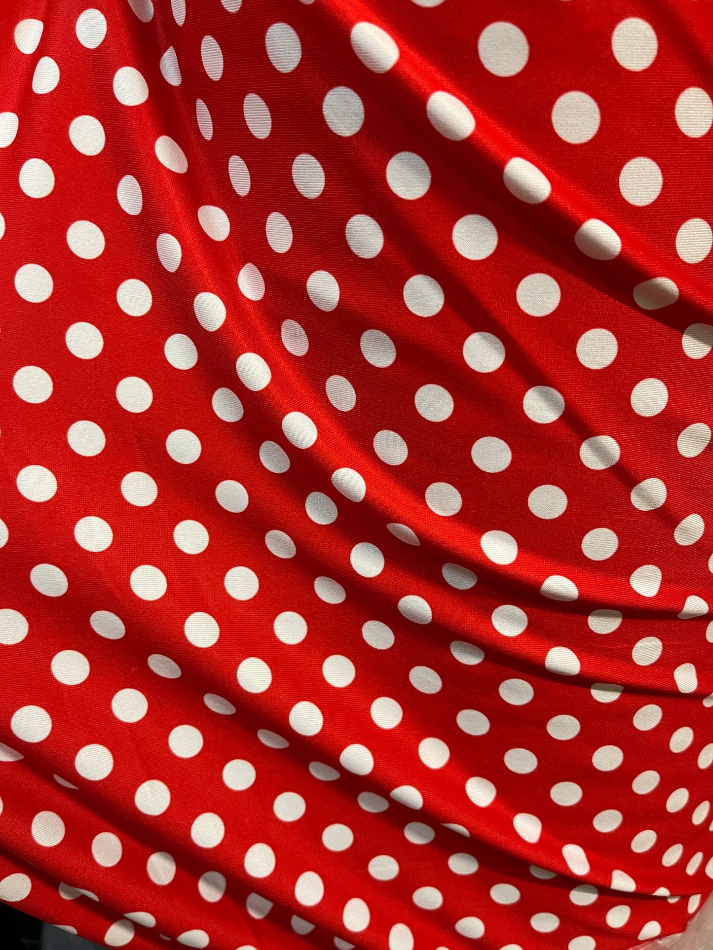 New spandex polka dots Design Red/white 4 way stretch poly spandex 58/60” Sold by the YD. Ships worldwide from Los Angeles California USA.