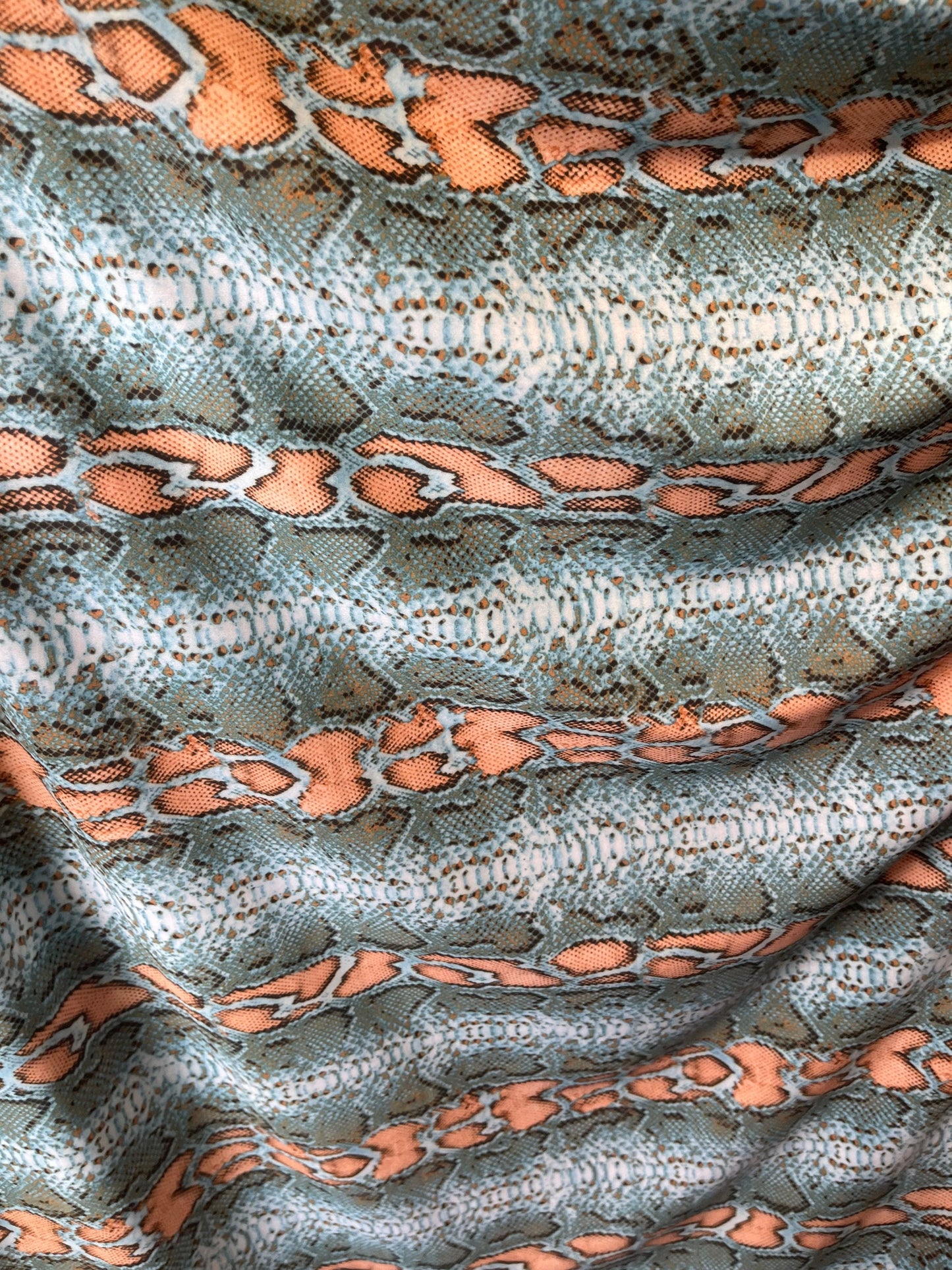 Exotic snake design Nude/Blue color print on best quality of nylon spandex 4-way stretch 58/60” Sold by the YD. Ships Worldwide from L.A CA