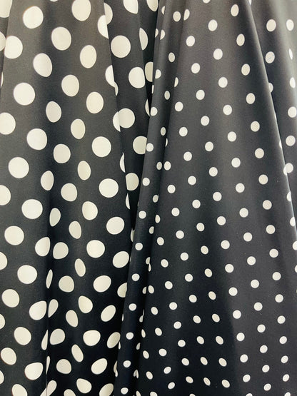 Polka dots design print on best quality of nylon spandex 4-way stretch 58/60” Sold by the YD. Ships Worldwide from Los Ángeles California