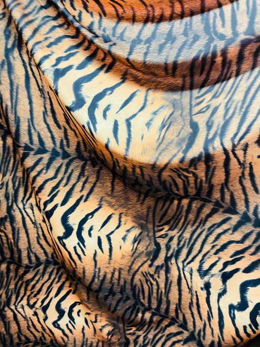 Tiger design Exotic animal print on great quality of nylon spandex 4-way stretch 58/60” Sold by the YD. Ships Worldwide from Los Ángeles CA