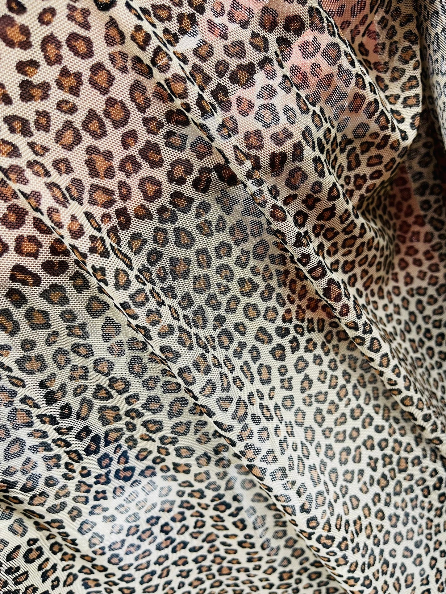 Small cheetah design Taupe/Brown print on great quality of power mesh 4-way stretch 58/60” Sold by the YD. Ships Worldwide