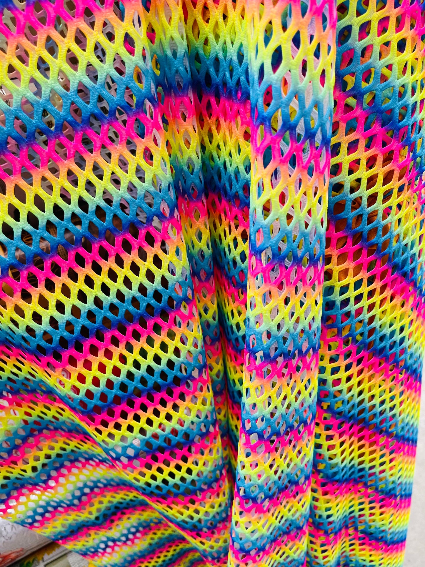 New Rainbow Diamond fishnet 4-way stretch 58/60” Sold by the YD. Ships Worldwide from Los Angeles California USA.