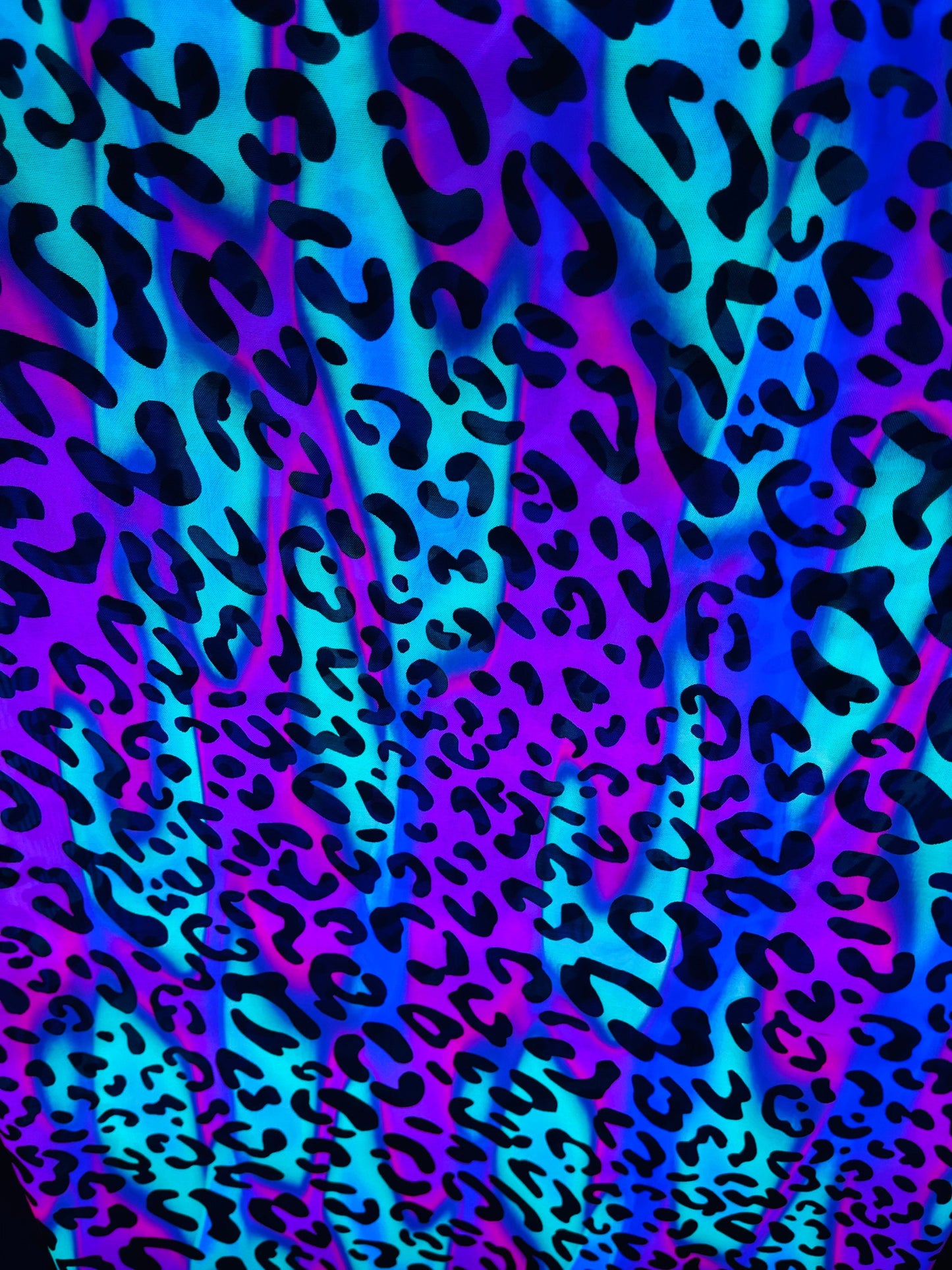 Exotic Leopard design it glows in the dark with black light print on best quality of nylon power mesh 4-way stretch 58/60” Sold by the YD.