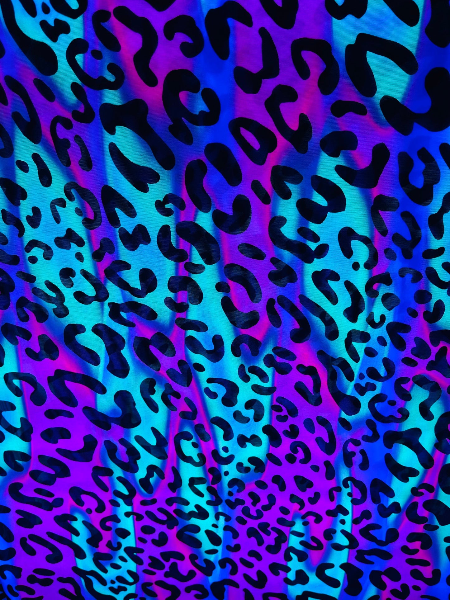 Exotic Leopard design it glows in the dark with black light print on best quality of nylon power mesh 4-way stretch 58/60” Sold by the YD.