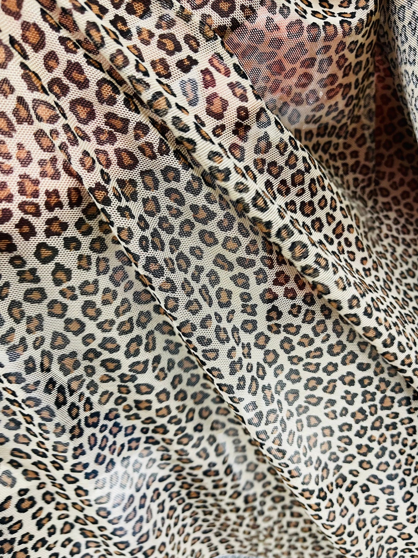 Small cheetah design Taupe/Brown print on great quality of power mesh 4-way stretch 58/60” Sold by the YD. Ships Worldwide