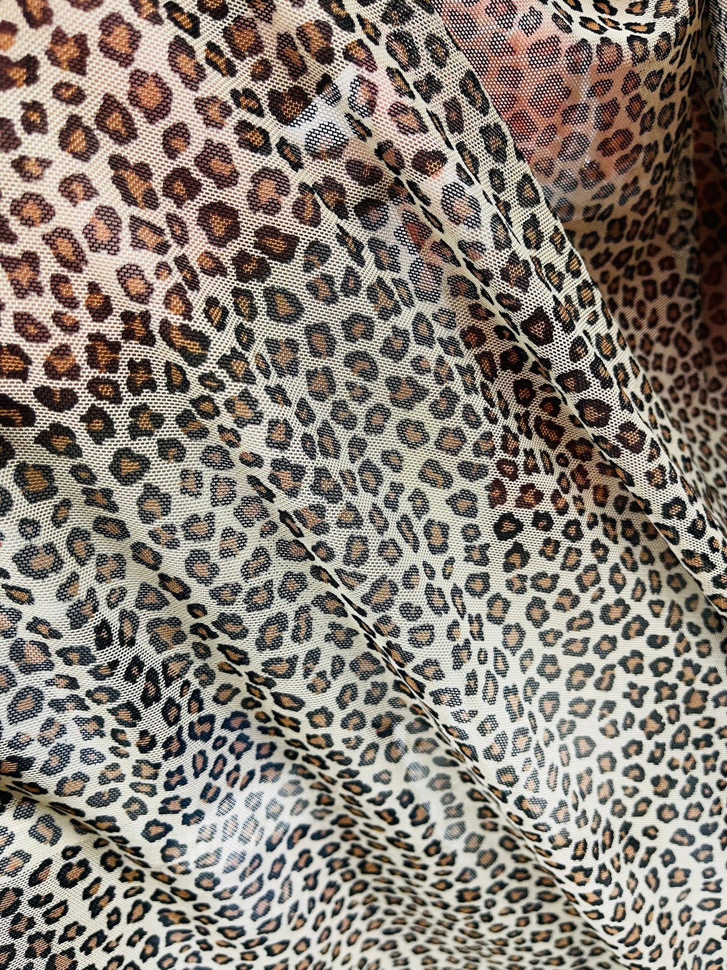 Small cheetah design Taupe/Brown print on great quality of power mesh 4-way stretch 58/60” Sold by the YD. Ships Worldwide