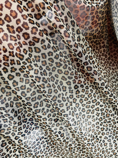 Small cheetah design Taupe/Brown print on great quality of power mesh 4-way stretch 58/60” Sold by the YD. Ships Worldwide