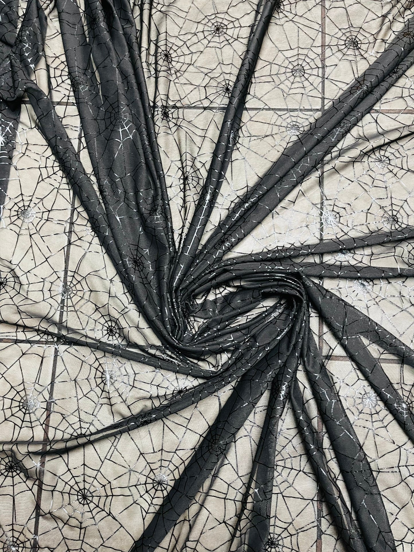 Spiderweb design metallic print on great quality of nylon power mesh 4-way stretch 58/60” Sold by the YD. Ships Worldwide from Los Angeles