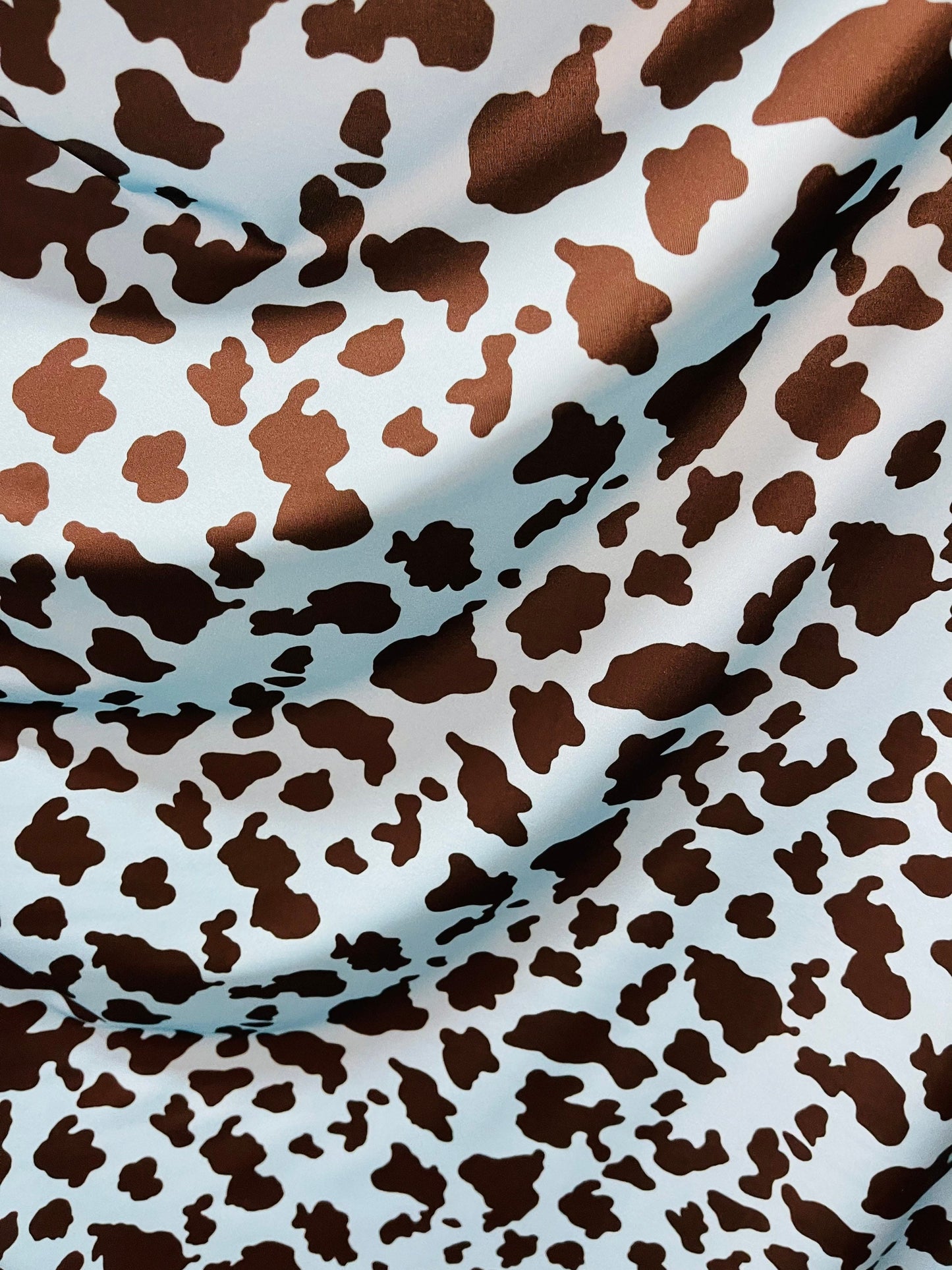 Exotic cow design Turquoise/Black print on great quality of Nylon Spandex 4-way stretch 58/60” Sold by the YD. Ships Worldwide