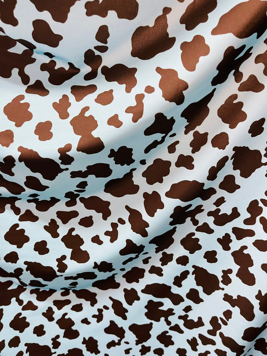 Exotic cow design Turquoise/Black print on great quality of Nylon Spandex 4-way stretch 58/60” Sold by the YD. Ships Worldwide