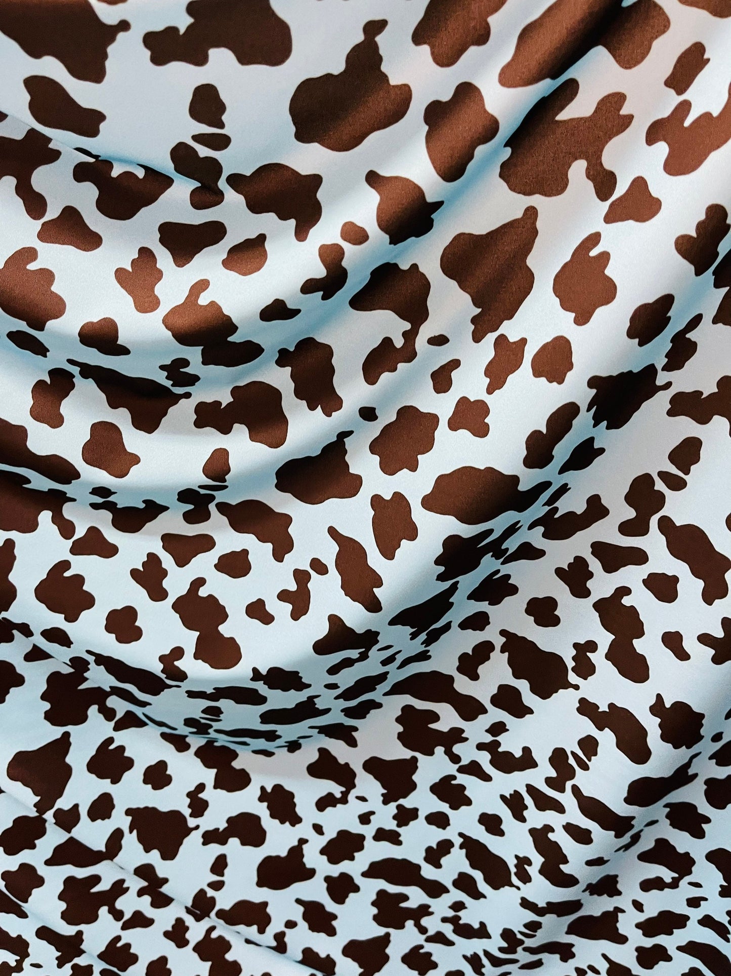 Exotic cow design Turquoise/Black print on great quality of Nylon Spandex 4-way stretch 58/60” Sold by the YD. Ships Worldwide