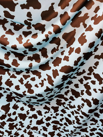 Exotic cow design Turquoise/Black print on great quality of Nylon Spandex 4-way stretch 58/60” Sold by the YD. Ships Worldwide