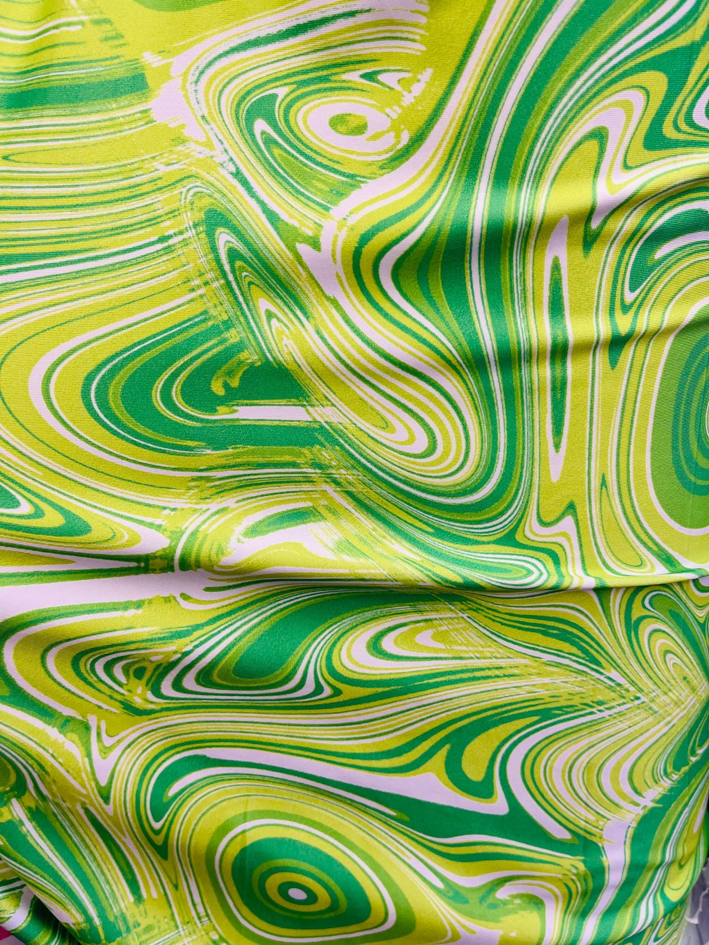 New abstract Lava design print on great quality of poly  spandex green/yellow 4-way stretch 58/60” Sold by the YD. Ships Worldwide from L.A