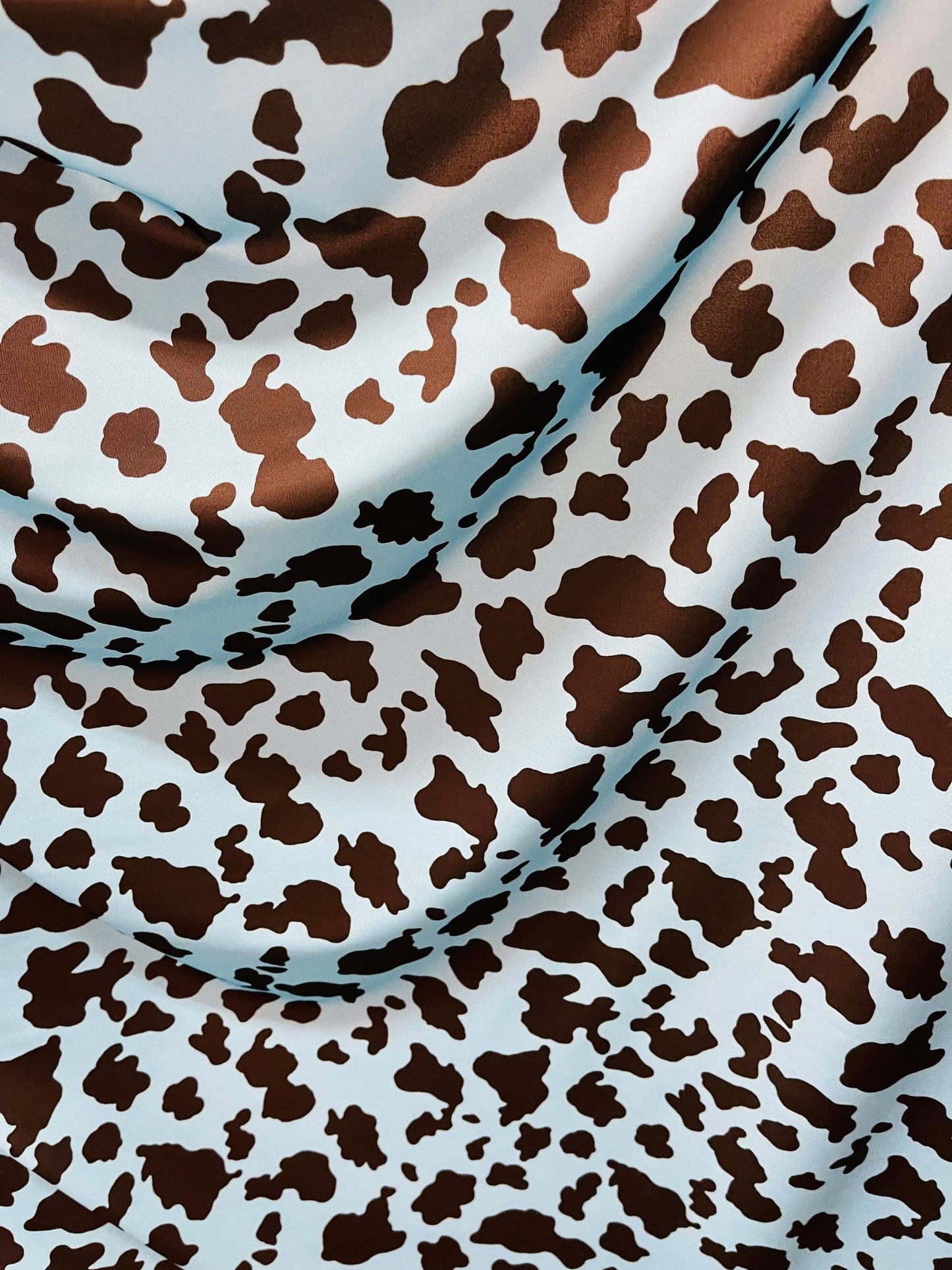 Exotic cow design Turquoise/Black print on great quality of Nylon Spandex 4-way stretch 58/60” Sold by the YD. Ships Worldwide