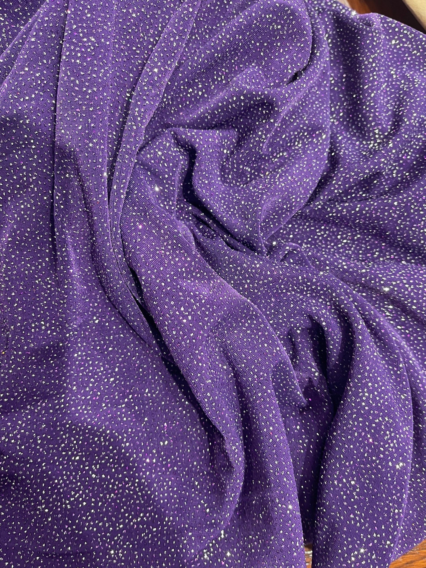 Selena design purple/silver poly spandex with glitter all over 4-way stretch 58/60” Sold by the YD. Ships Worldwide from Los Angeles CA