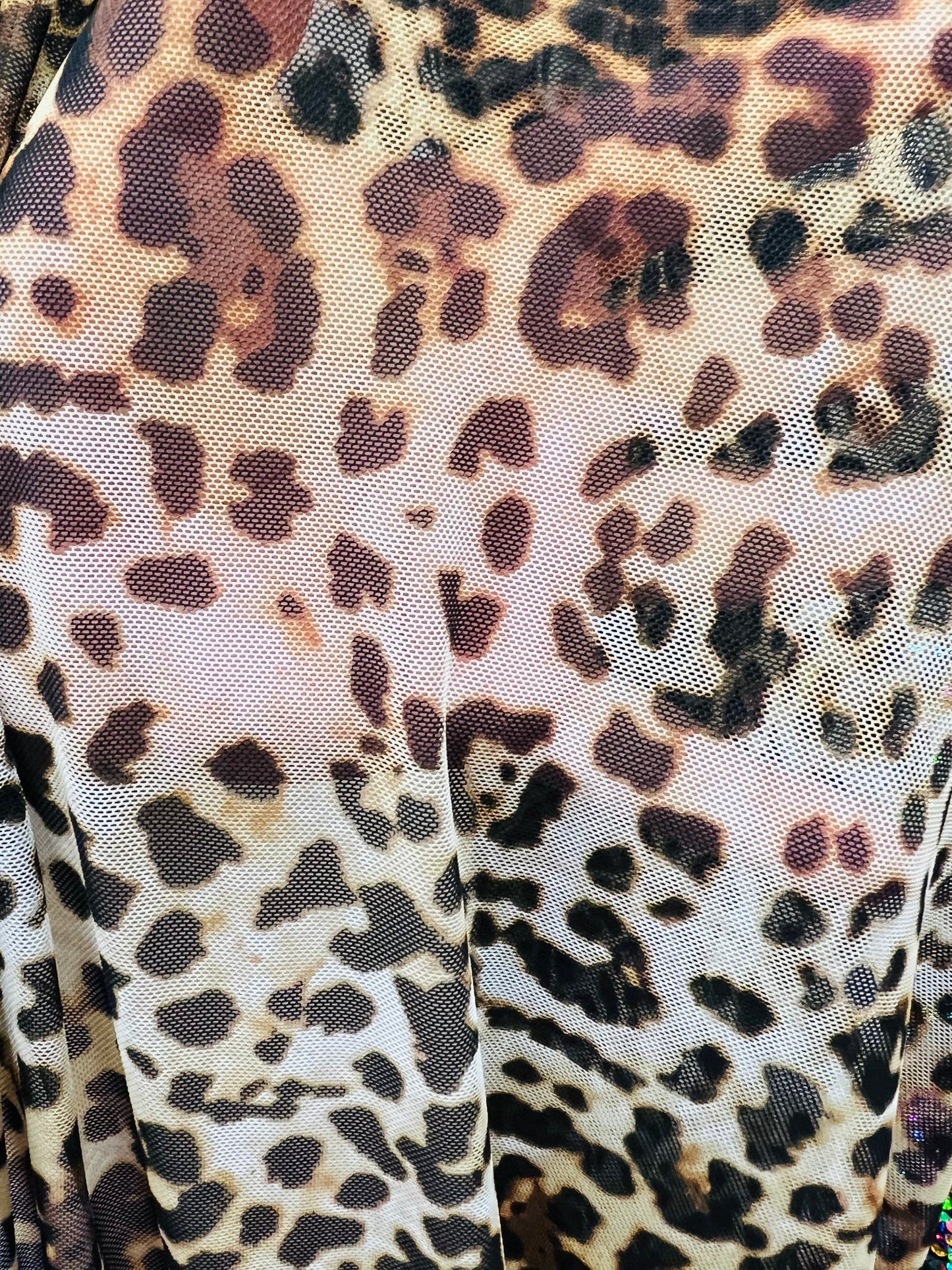 Leopard design print on great quality of power mesh 4-way stretch 58/60” Sold by the YD. Ships worldwide from Los Angeles California USA.