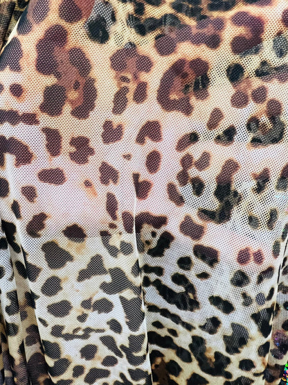 Leopard design print on great quality of power mesh 4-way stretch 58/60” Sold by the YD. Ships worldwide from Los Angeles California USA.