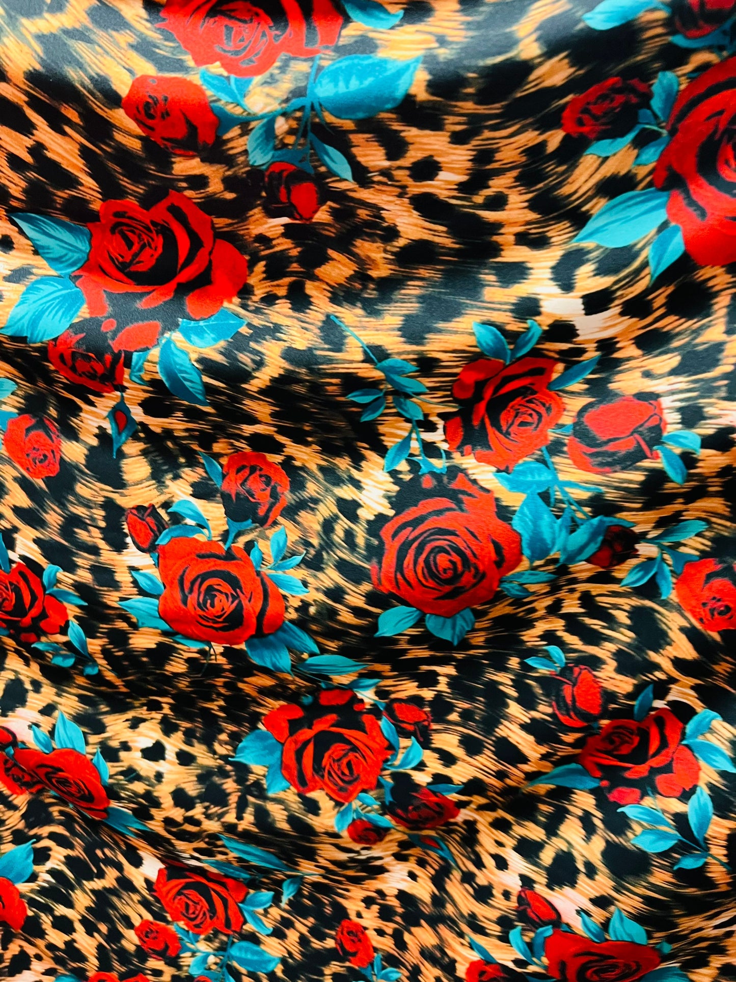 Exotic Leopard design with red flowers print on great quality of nylon spandex 4-way stretch 58/60” Sold by the YD. Ships worldwide from L.A