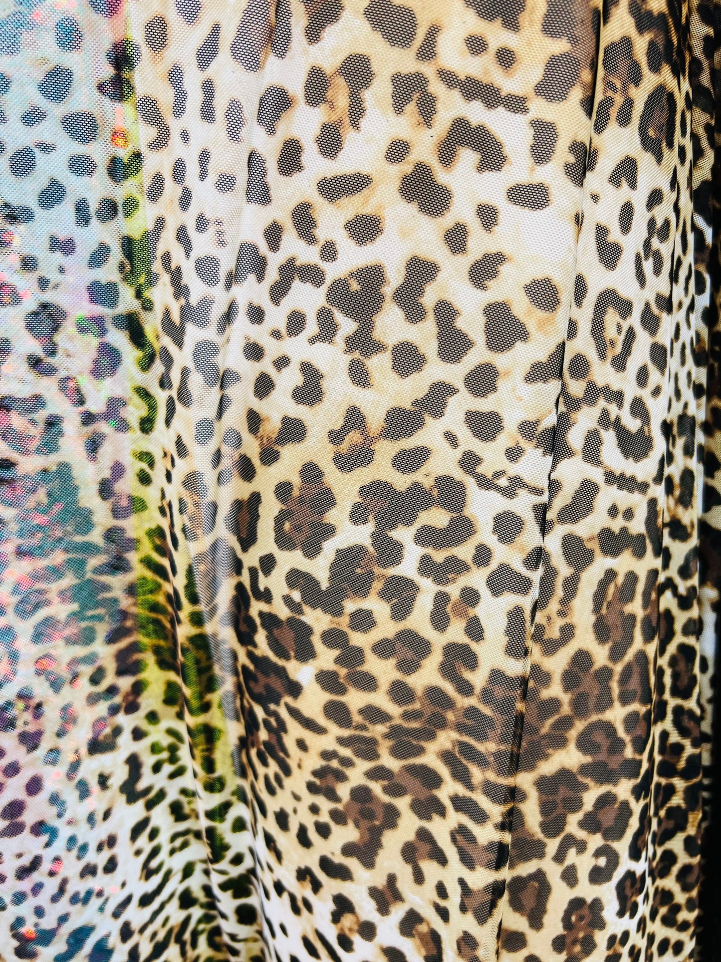 Leopard design print on great quality of power mesh 4-way stretch 58/60” Sold by the YD. Ships worldwide from Los Angeles California USA.