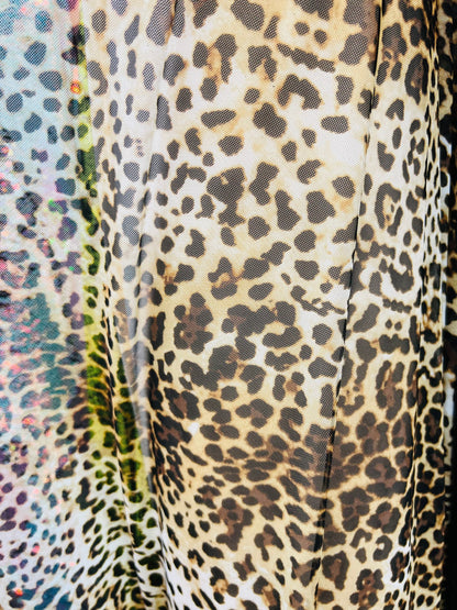 Leopard design print on great quality of power mesh 4-way stretch 58/60” Sold by the YD. Ships worldwide from Los Angeles California USA.
