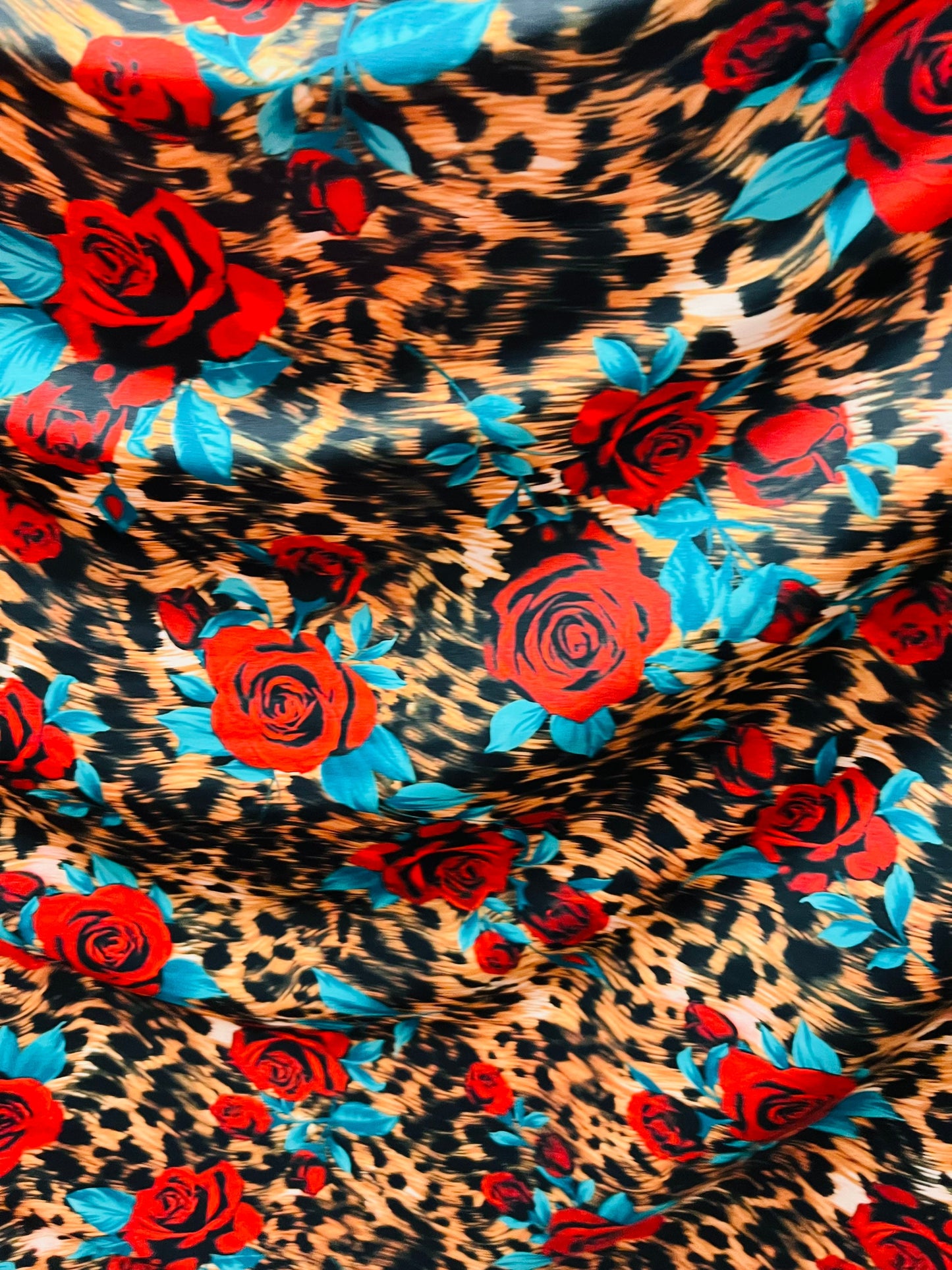 Exotic Leopard design with red flowers print on great quality of nylon spandex 4-way stretch 58/60” Sold by the YD. Ships worldwide from L.A