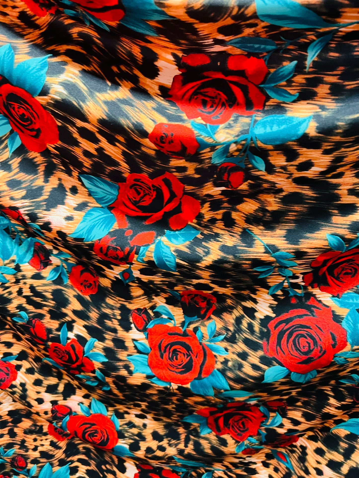 Exotic Leopard design with red flowers print on great quality of nylon spandex 4-way stretch 58/60” Sold by the YD. Ships worldwide from L.A