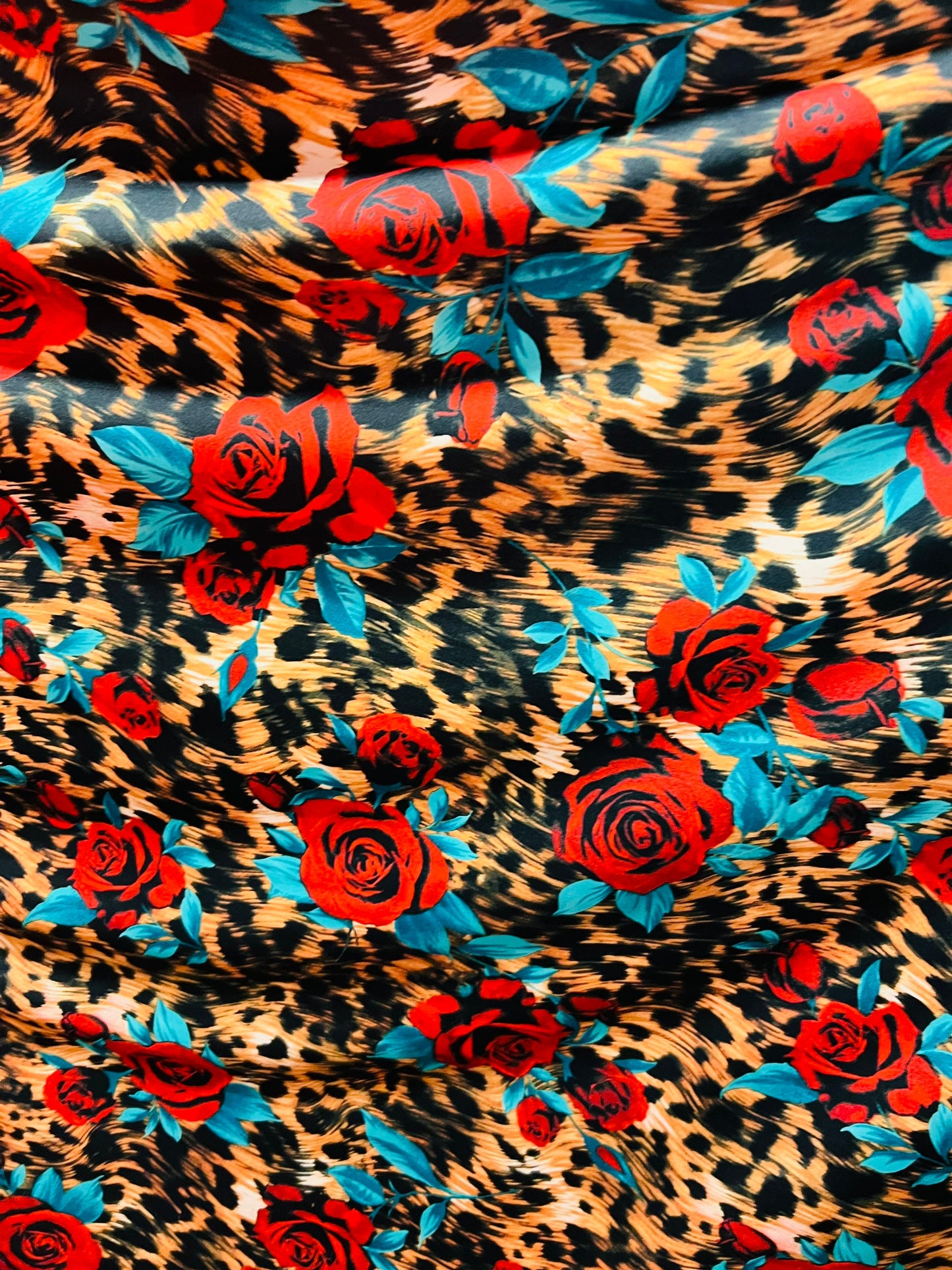 Exotic Leopard design with red flowers print on great quality of nylon spandex 4-way stretch 58/60” Sold by the YD. Ships worldwide from L.A