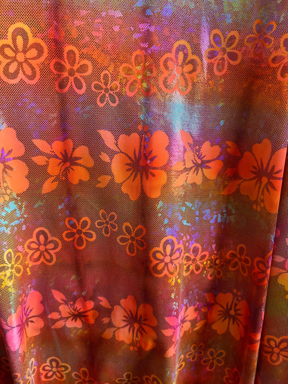 Hawaiian design hologram metallic nylon spandex 4-way stretch 58/60” Sold by the YD. Ships Worldwide from Los Angeles California USA.